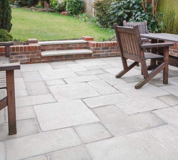 finished patio slabs and brick low retaining wall